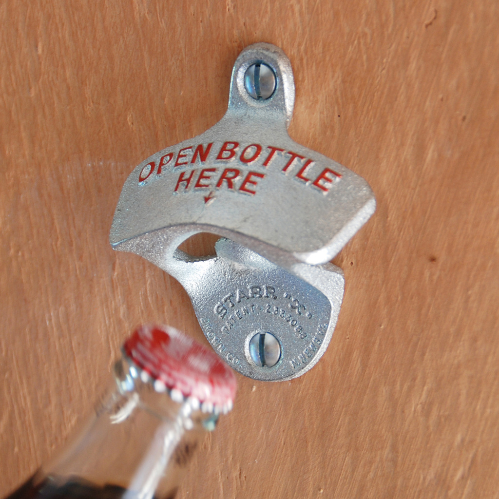 Kronkorkenöffner "Open here" Kronkorkenöffner "Open here"